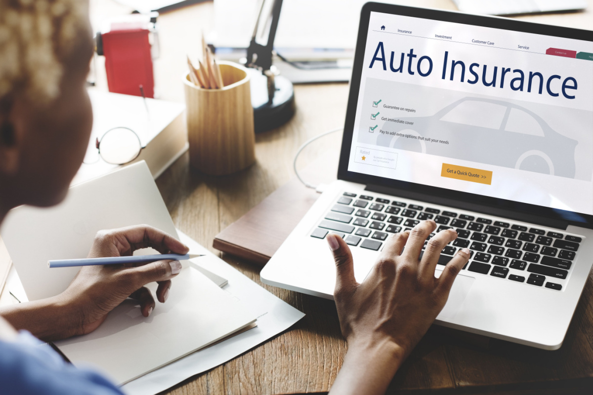 Individual comparing car insurance rates online
