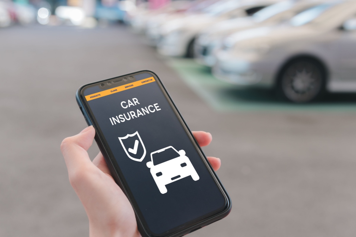Phone with car insurance on screen
