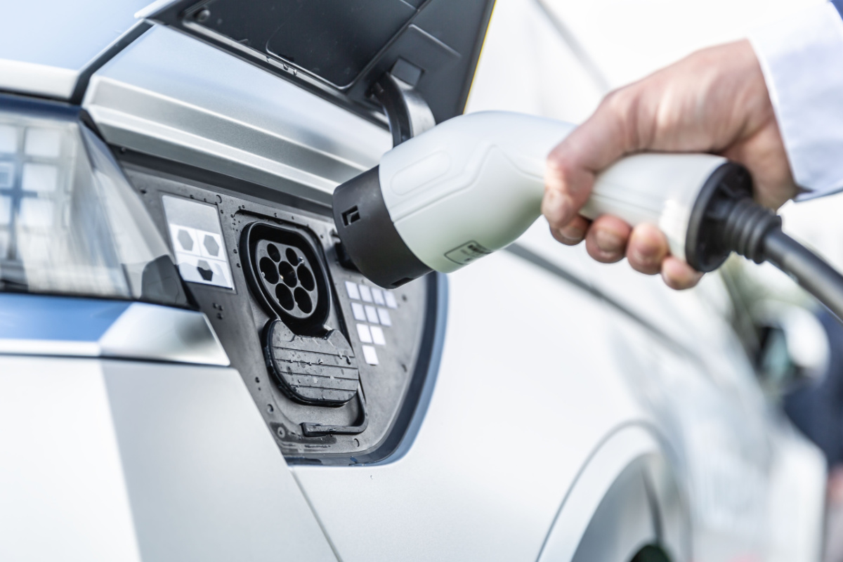 Driver charging electric car