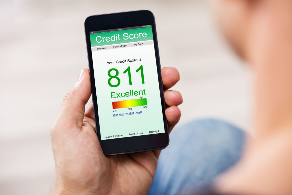 Individual checking credit score on cellphone