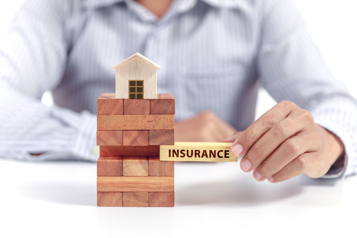 Wooden home and homeowners' insurance blocks