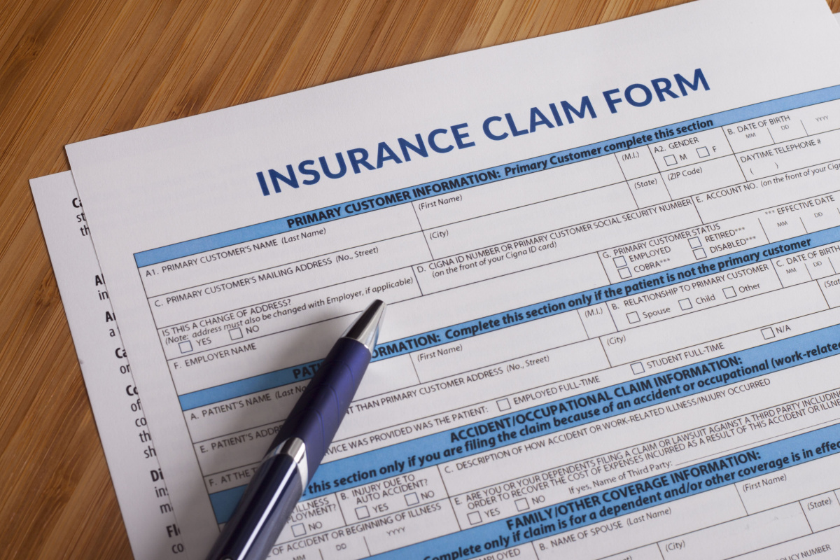Close up on insurance claim paperwork