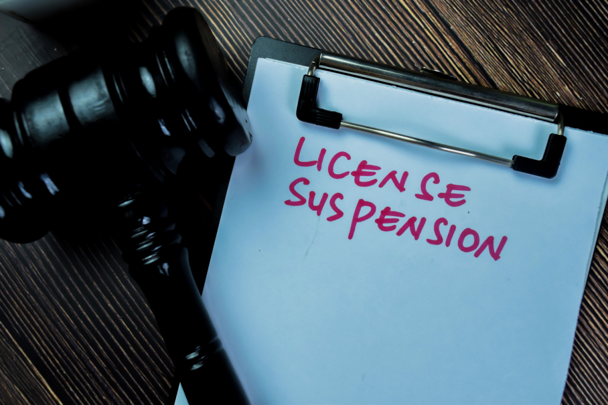 License suspension paperwork next to gavel